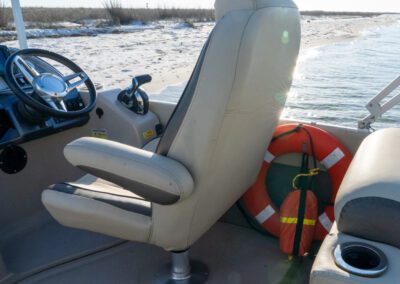 Charter pontoon boat with slide and captain.